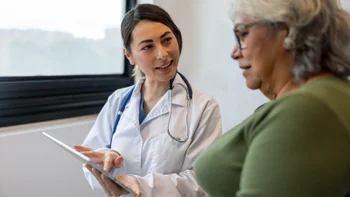HCP: HCP with clipboard speaking to patient 2219405083