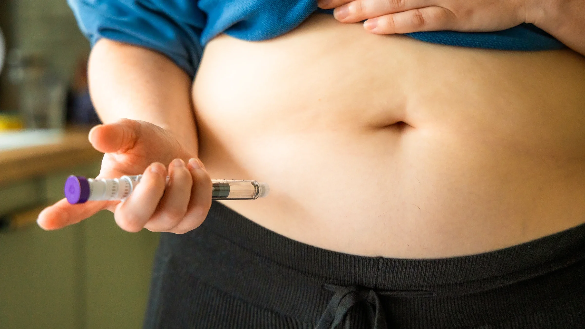 A close-up injection in the abdomen.