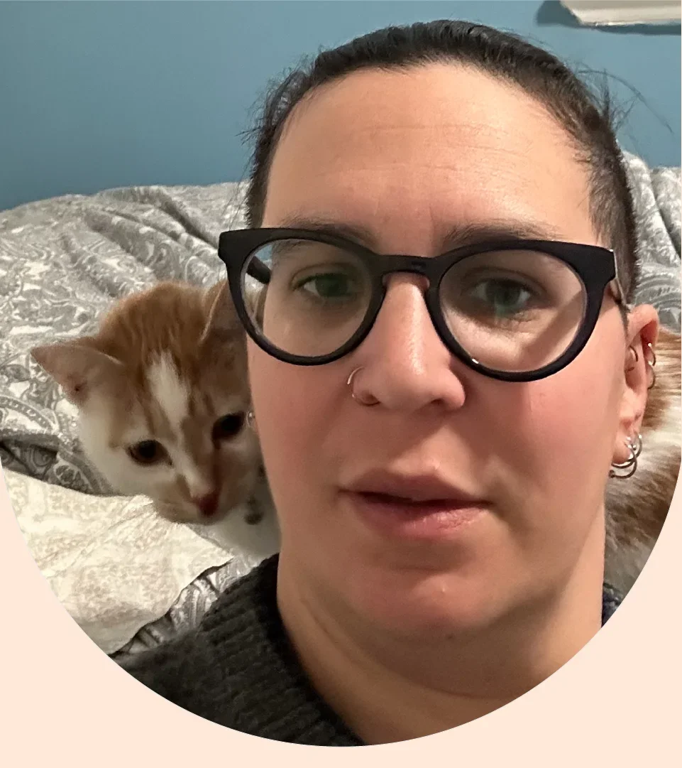 Picture of Em Willatt and her foster cat. 