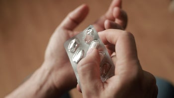 Health: Lexapro: closeup hands blister pill pack 1345963742