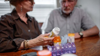 High cholesterol: couple pill organizer 1410194425