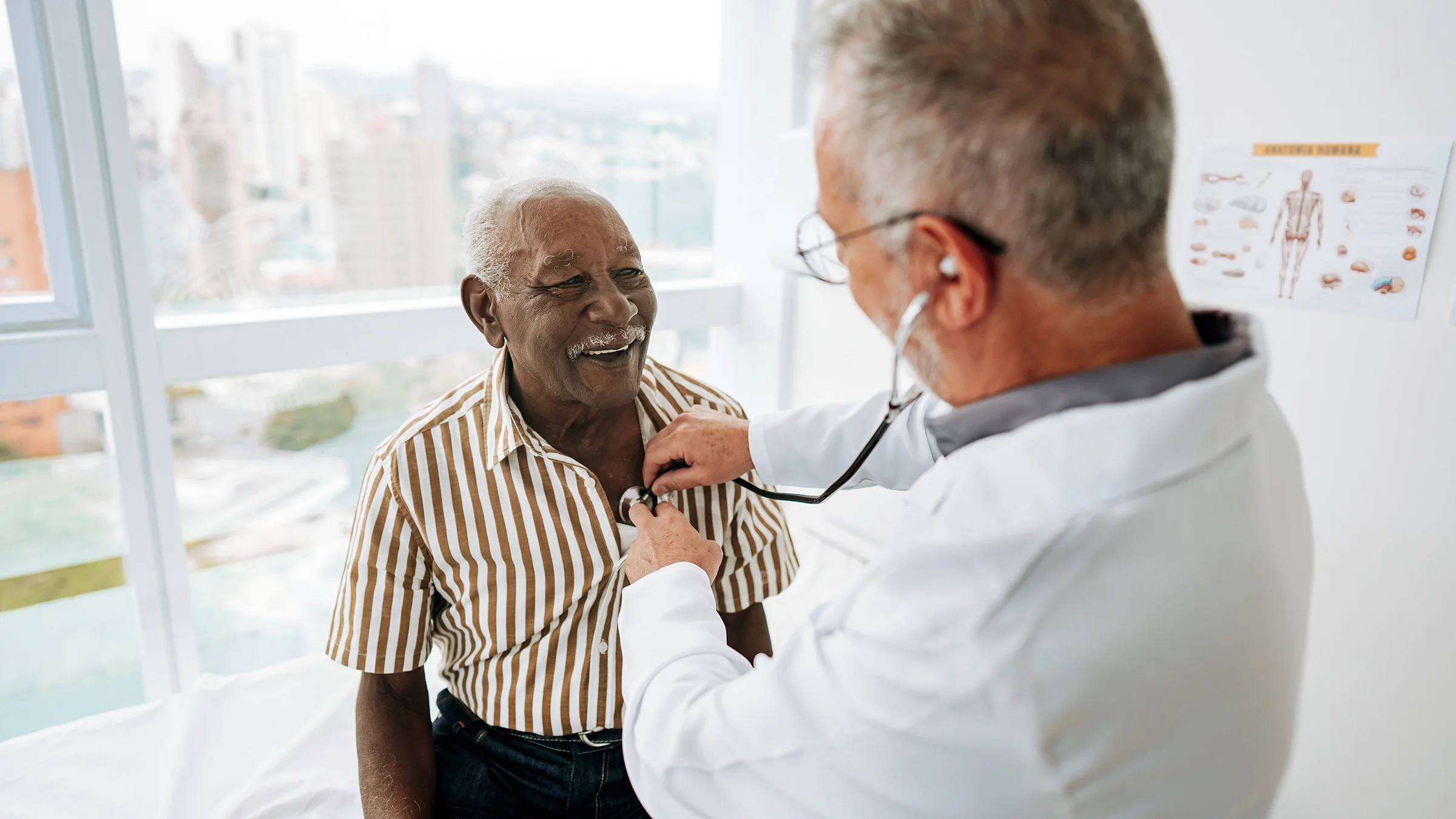 Doctor listening to a patient's heartbeat.