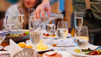Substance use: Sober curious: cropped pouring water instead of wine 1386907456