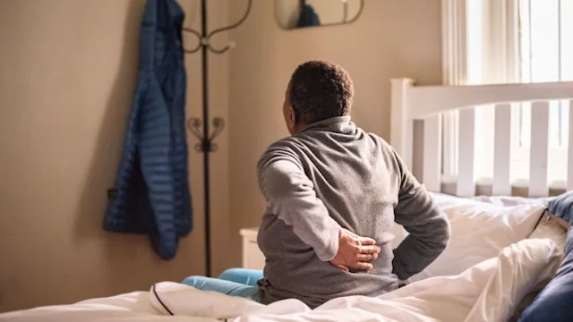 Pain: Reprocessing therapy: woman chronic back pain 1290703461