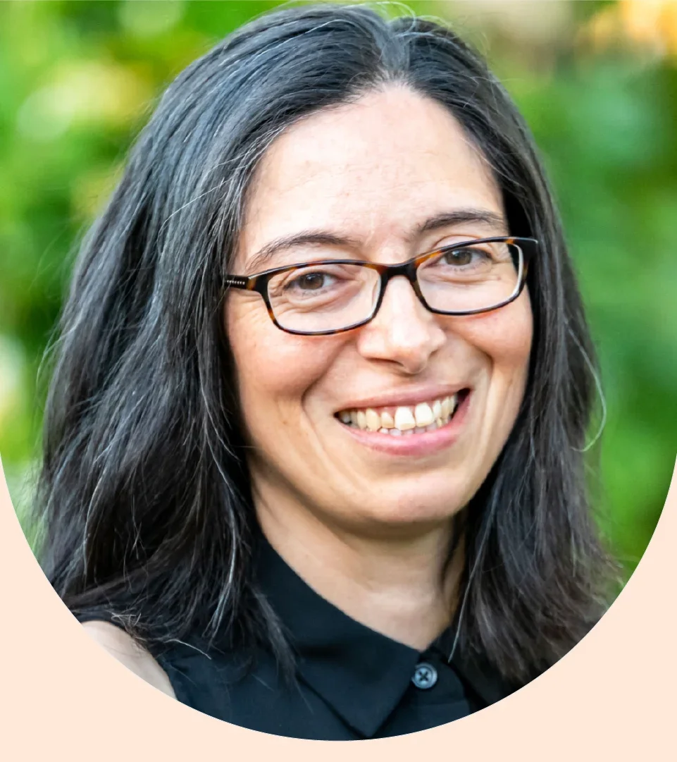 Mikel Delgado is pictured in a headshot.