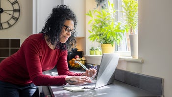 Drug Cost and Savings: Personal Finance: woman paying a bill online 1472060690