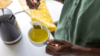 Gut-health: closeup making tea in mug 1496354928