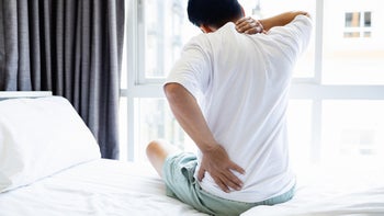 ankylosing spondylitis: man with back pain in bed 1552395440