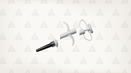 In the center of a light gray background with texture and warning sign pattern is a white and gray plastic syringe cut into thirds. 
GoodRx Health