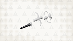 In the center of a light gray background with texture and warning sign pattern is a white and gray plastic syringe cut into thirds. 
GoodRx Health