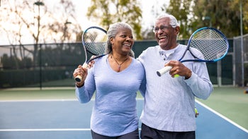 Anticoagulants: senior couple playing tennis 1464605292