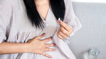 Health: Proton pump inhibitors: closeup woman stomach pain 1349674536