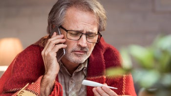 Fever: emergency room: sick holding thermometer phone call 903708662