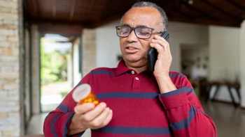 Men's Health: senior man calling for prescription 1480671035