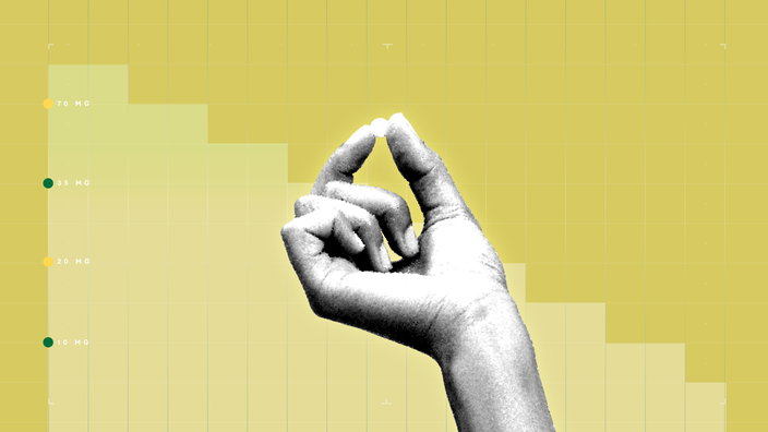 A black-and-white image of a hand holding a pill is set against a yellow graph-paper background and step graph.