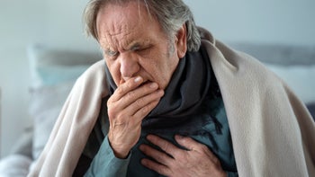 Health: Flu: senior man coughing 1442911781