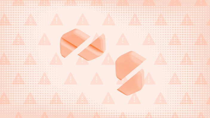 Two hexagon-shaped pills, each cut in half, are shown on a light orange background with a warning sign pattern.
