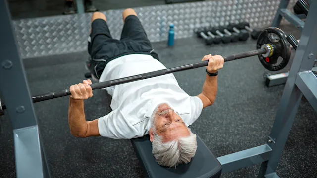 Movement-exercise: man doing bench press exercise 1363762649