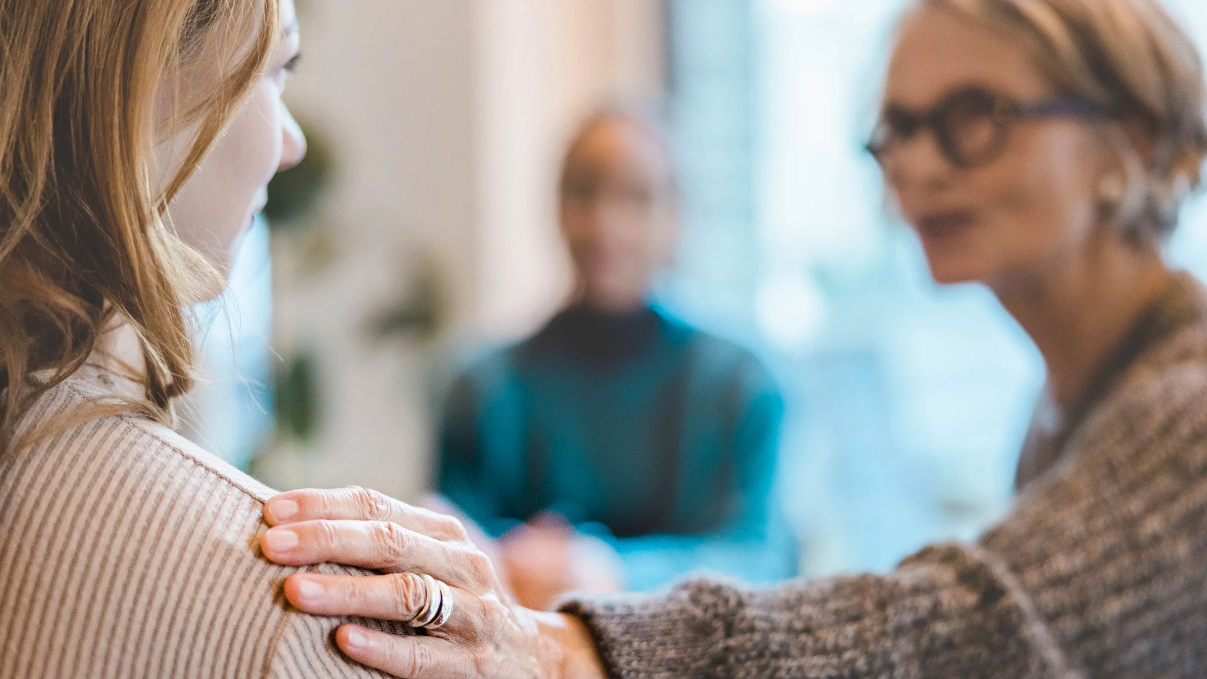 A therapist comforting a client.