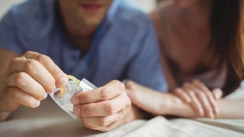 Behavioral addiction: Sex addiction: couple-opening-condom-639007992