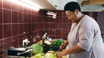 diet-nutrition: woman preparing a meal at home 2166297531