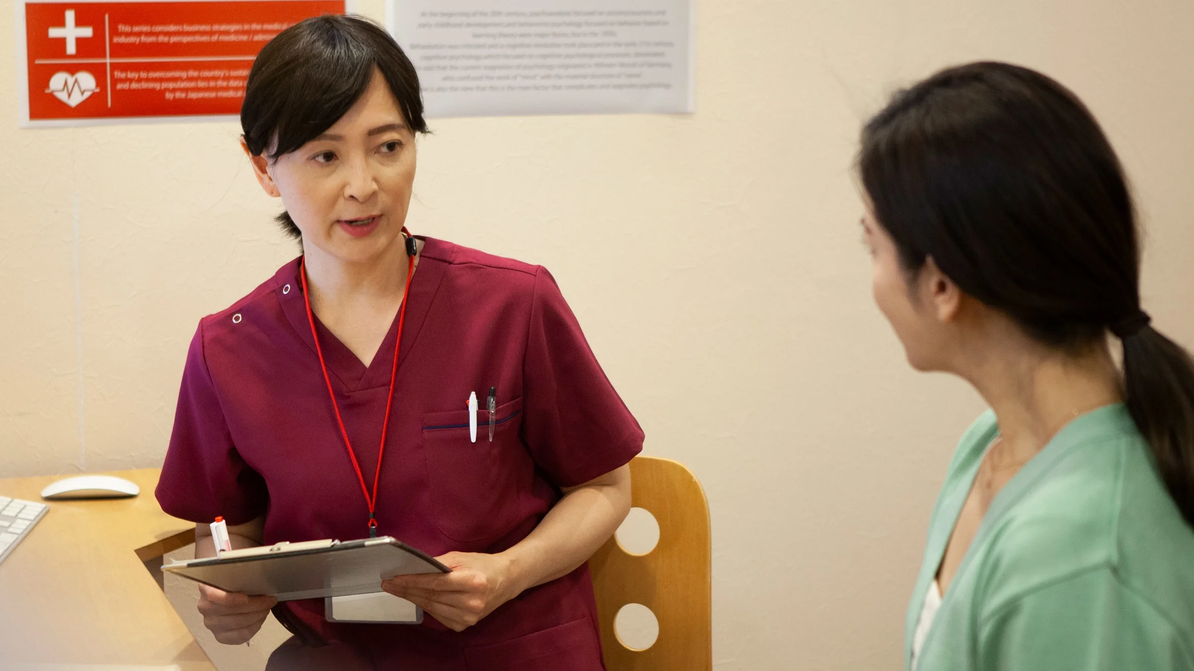 A gynecologist talking to a patient.