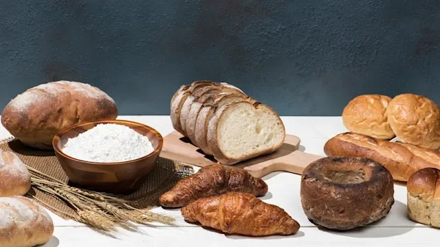 diet-nutrition: assortment of breads on a table 1768101968