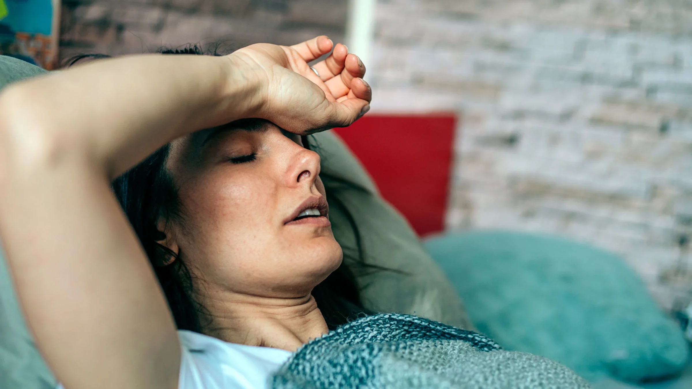 A woman is in bed with night sweats.
VioletaStoimenova/E+ via Getty Images

