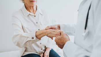 rheumatoid-arthritis: closeup senior woman with wrist pain 1465572887