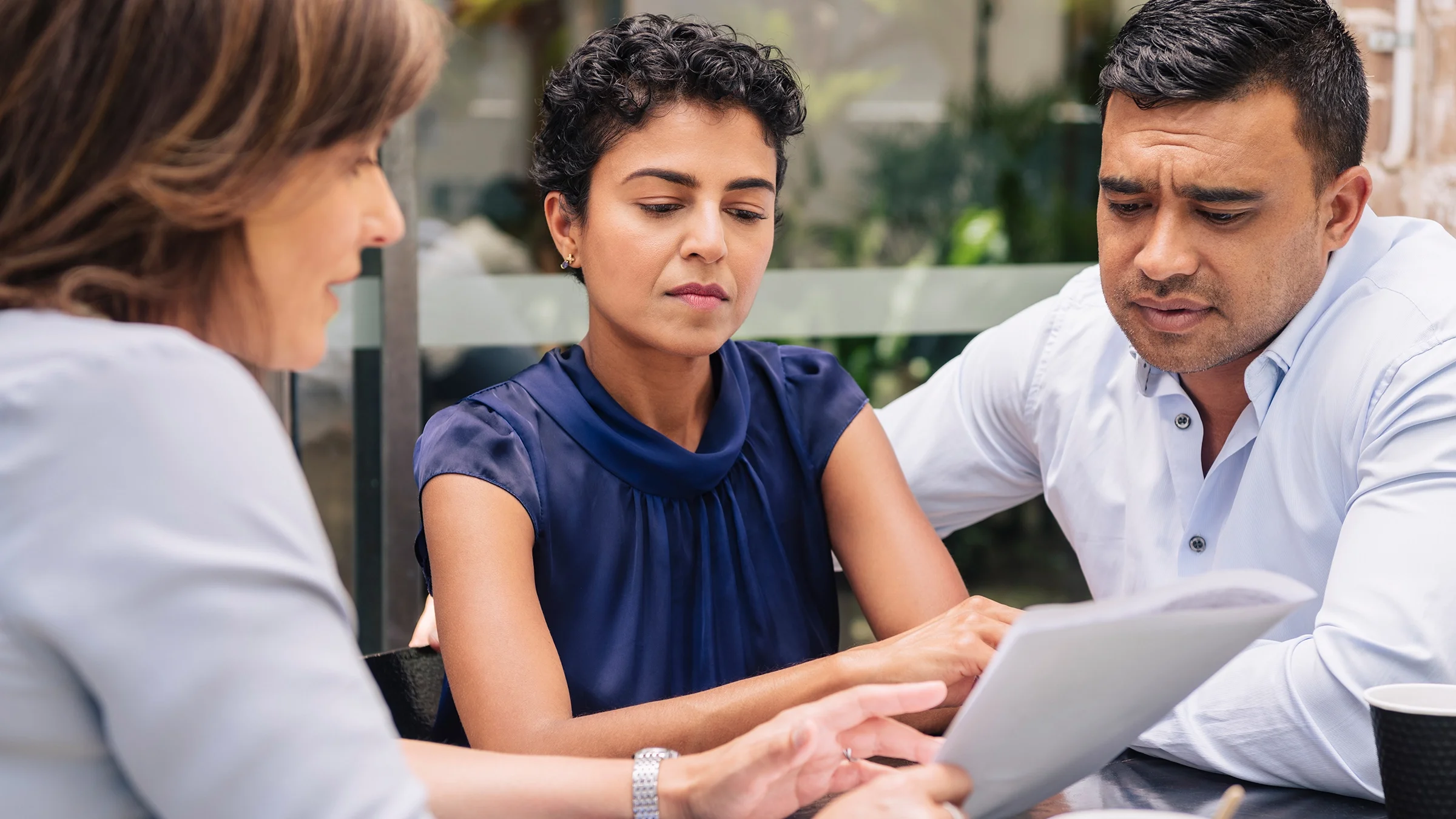A couple receives professional advice from a financial advisor.