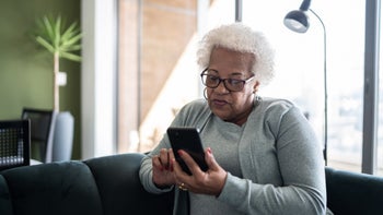 Health: Insurance: senior woman using smart phone-1330522037