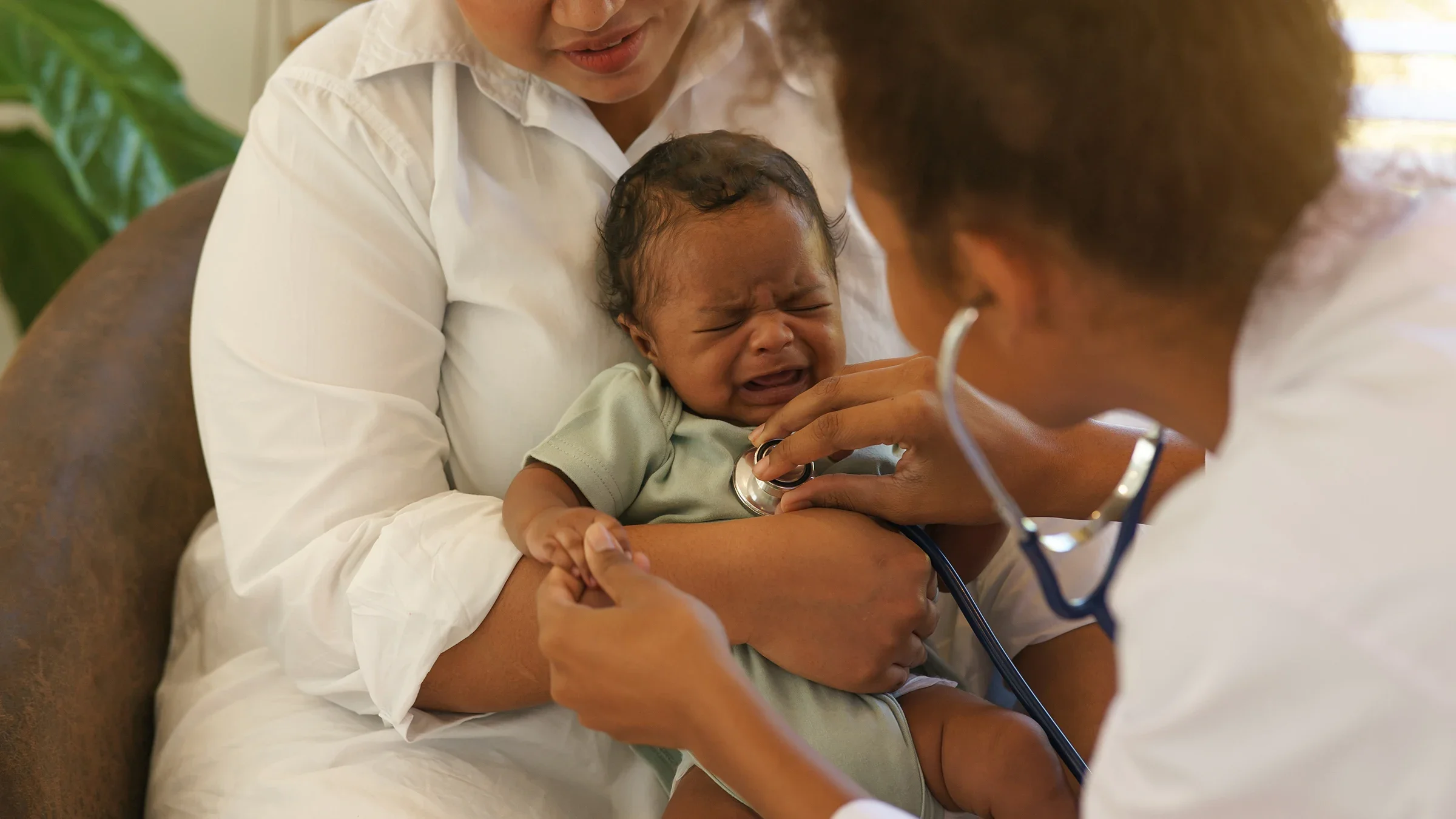 Baby crying sick at pediatrician checkup.
Buntiam /iStock via Getty Images Plus