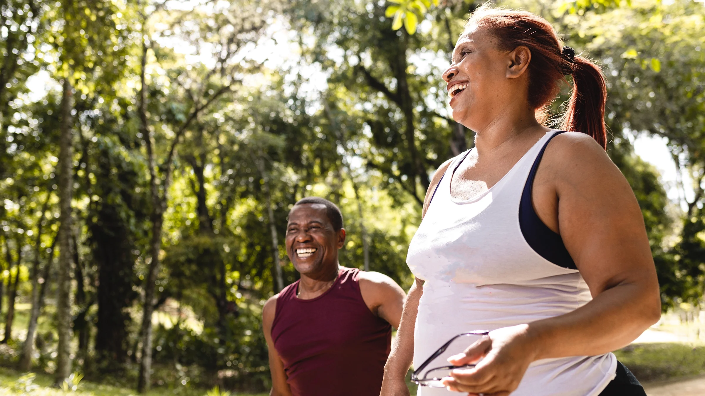Man and woman walking in the park.
