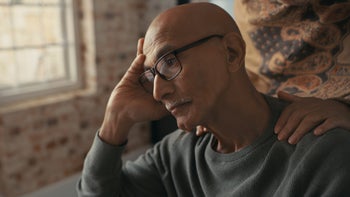 Substance use disorder: depressed person spouse hands on shoulder 1354243812