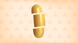 Light-orange background with texture and warning sign pattern. In the center is a yellow-orange gel pill cut into thirds. 
GoodRx Health 
