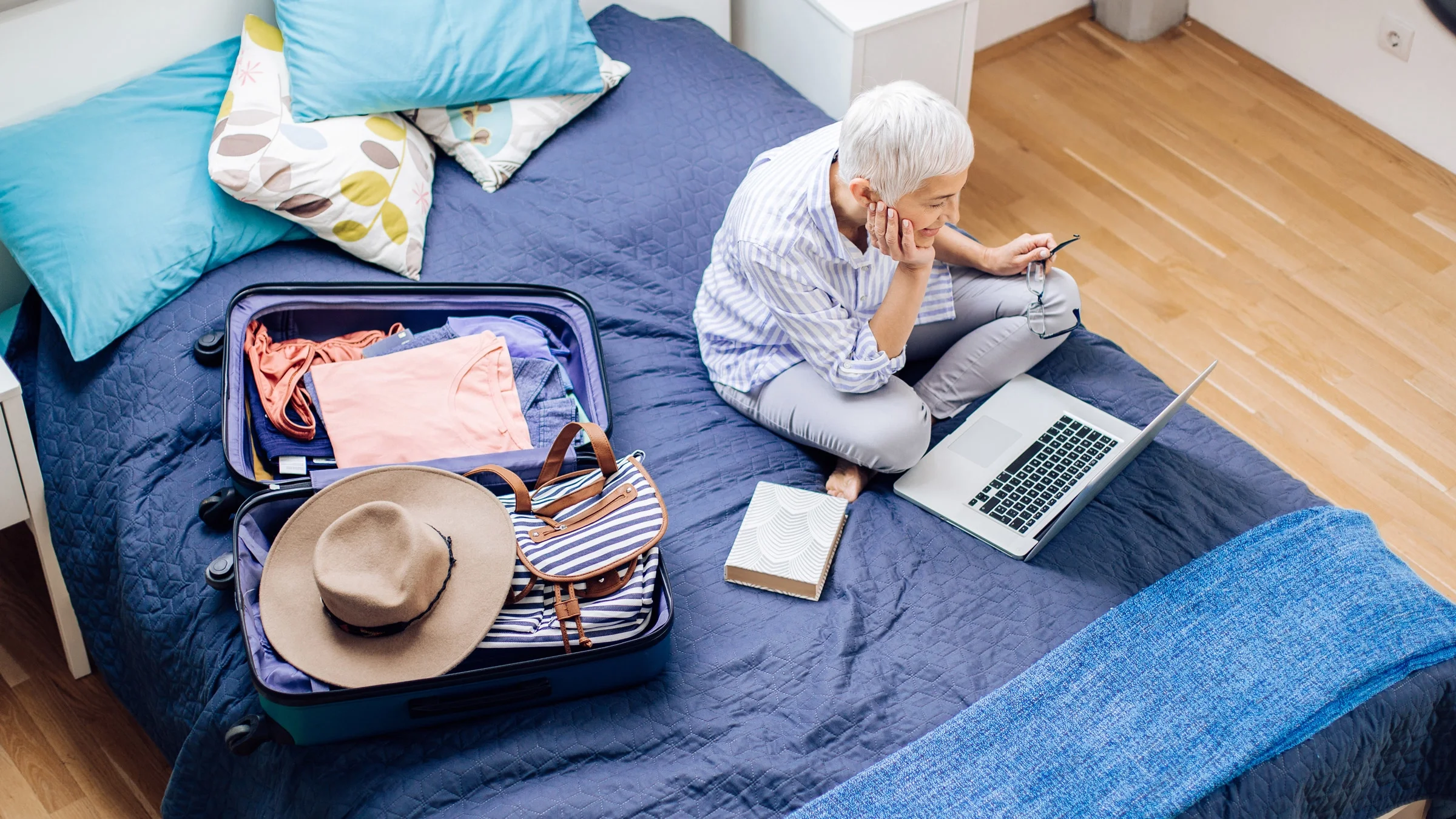 Using laptop while packing.