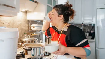 diet-nutrition: woman making soup at home 1295451166