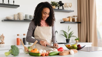 PCOS: woman prepping healthy meal 1423052682