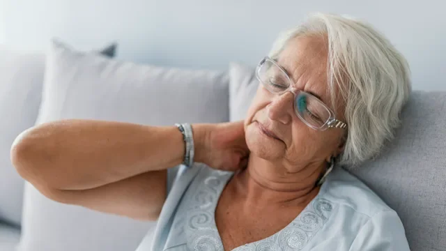 Health: Musculoskeletal: senior woman with neck pain 1034261340