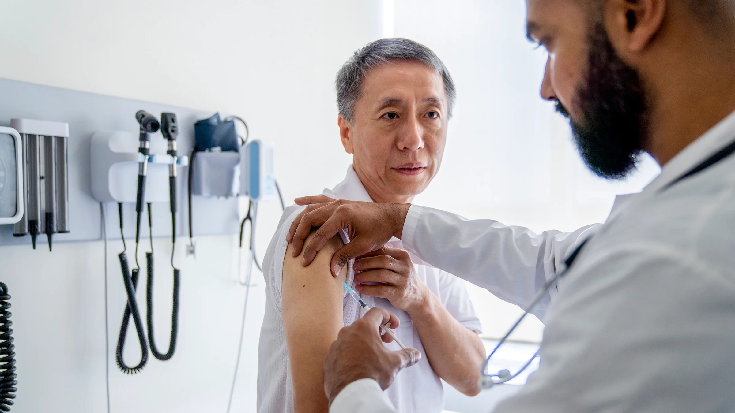 An adult is receiving a flu shot.