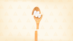 Tan orangish background with texture and warning sign pattern. In the center is a wooden spoon with two white pills cut into thirds.
GoodRx Health
