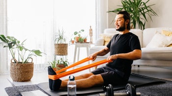 Musculoskeletal: Upper cross syndrome exercises: man doing resistance band row exercise 1294175391