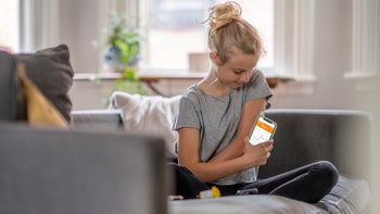 Medical supplies and devices: FreeStyle Libre: young kid checking insulin levels 1324060211