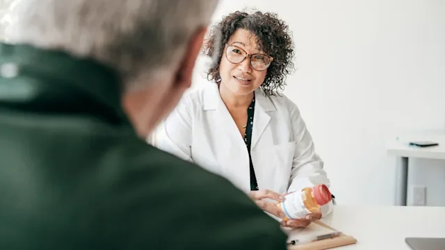 Health: doctor consultation with senior man prescription1168255944
