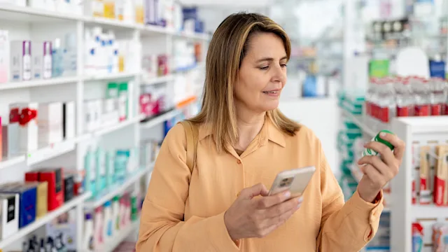 Supplements and herbs: woman buying medication in phamarcy 1778307369