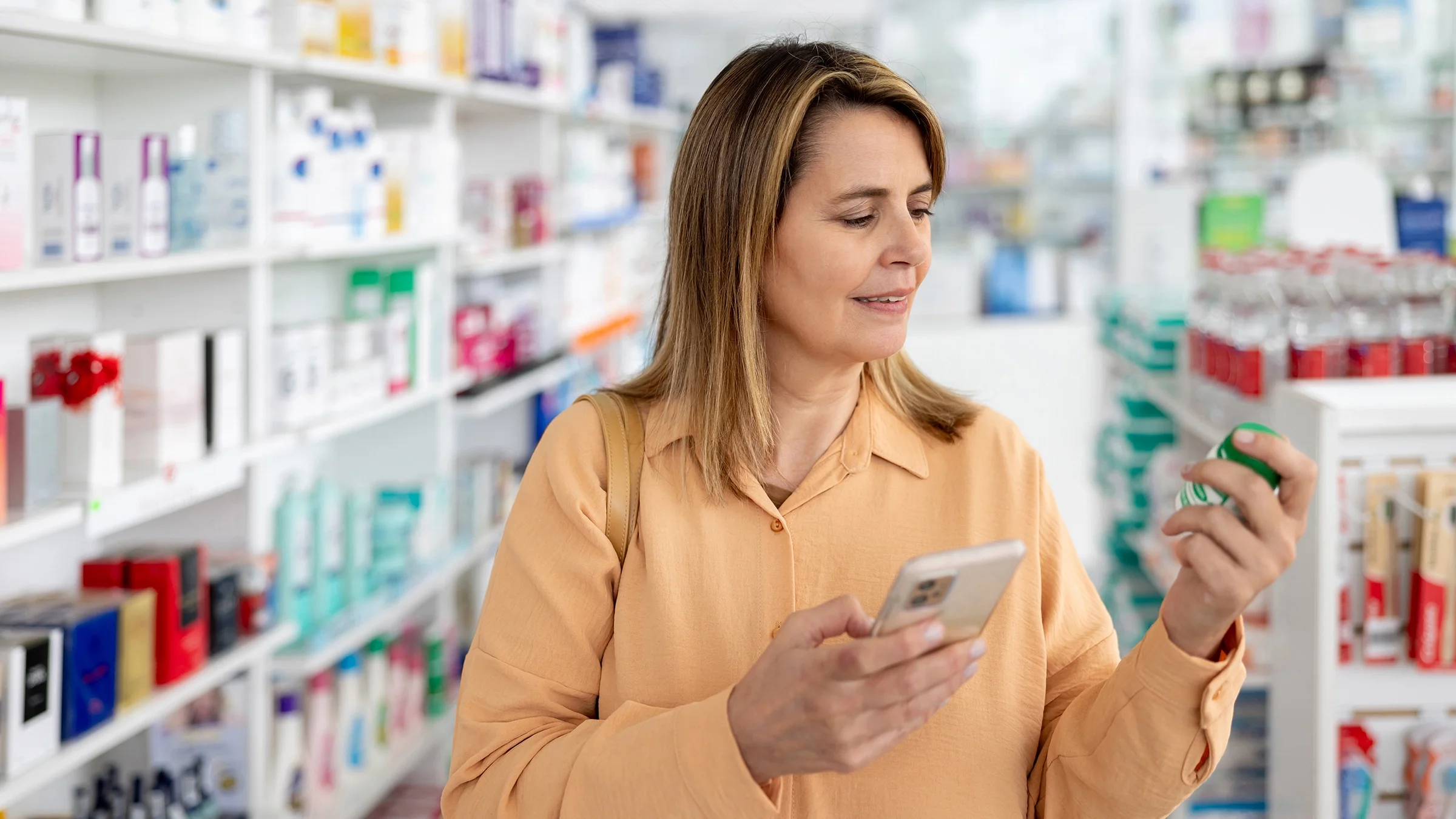Woman buying medicine at the pharmacy.