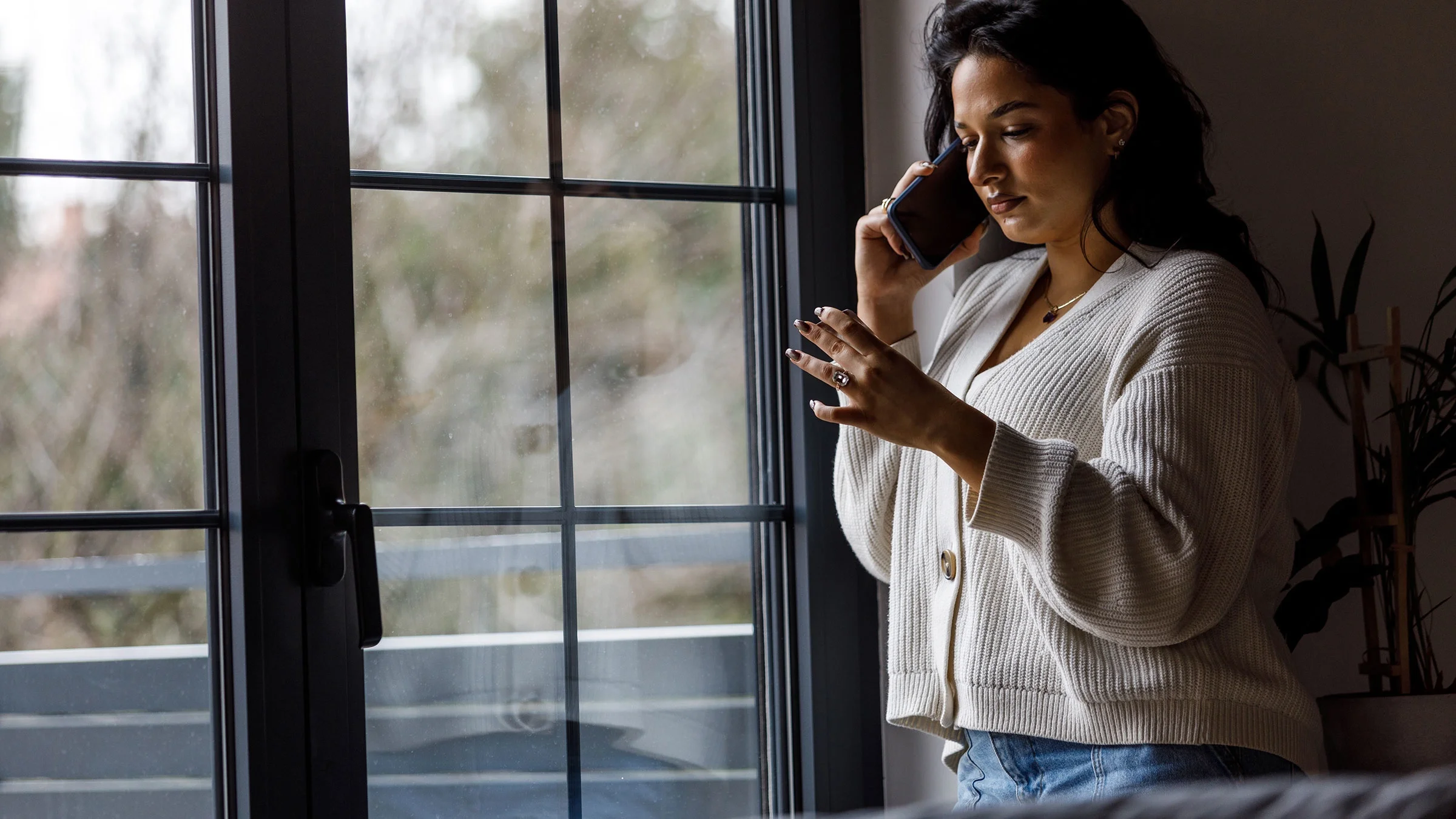 Woman talking on the phone with her doctor and discussing her medication