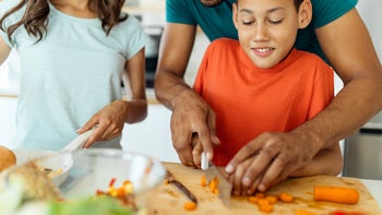 Children’s-Health: family cooking together at home 1354582899