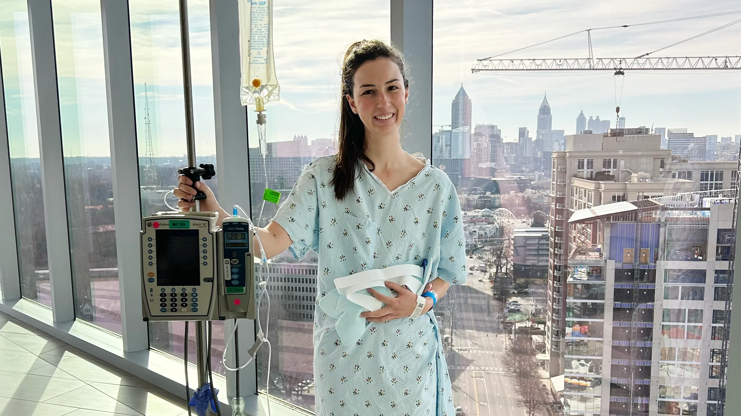 Jordan Bennie is pictured walking in the hospital unit one day after kidney surgery.