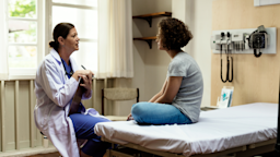 A doctor discusses symptoms with a patient.
Rawpixel/iStock via Getty Images Plus